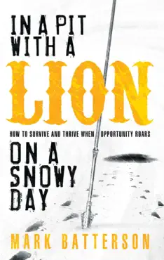 in a pit with a lion on a snowy day book cover image